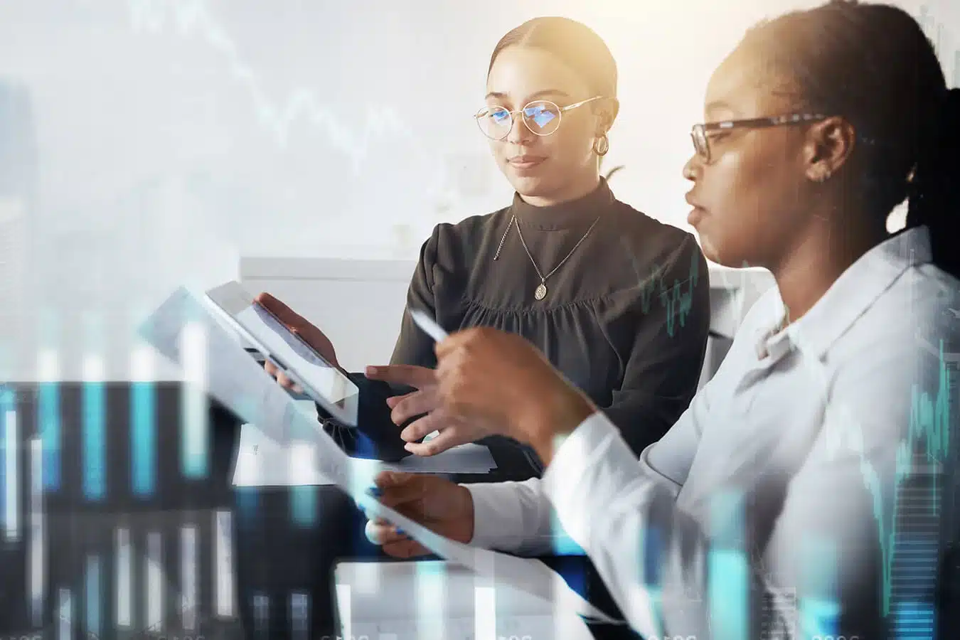 Two-women-discuss-financial-planning-analysis-documents